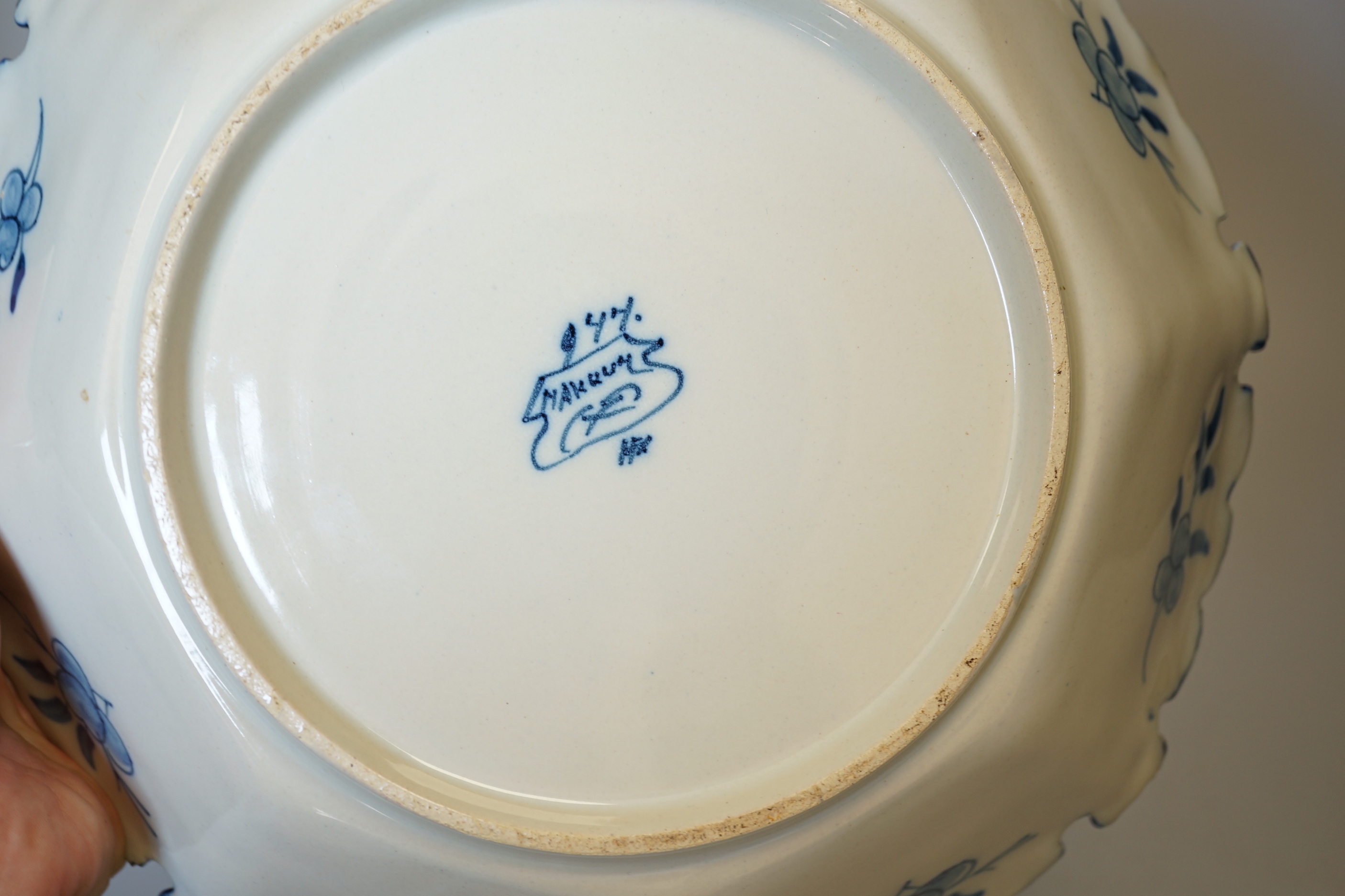 Two delftware dishes, largest 26cm, and a delftware clog